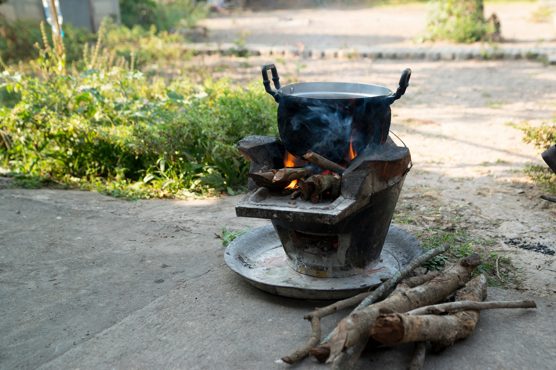 A cooking pot stove using firewood as fuel. 