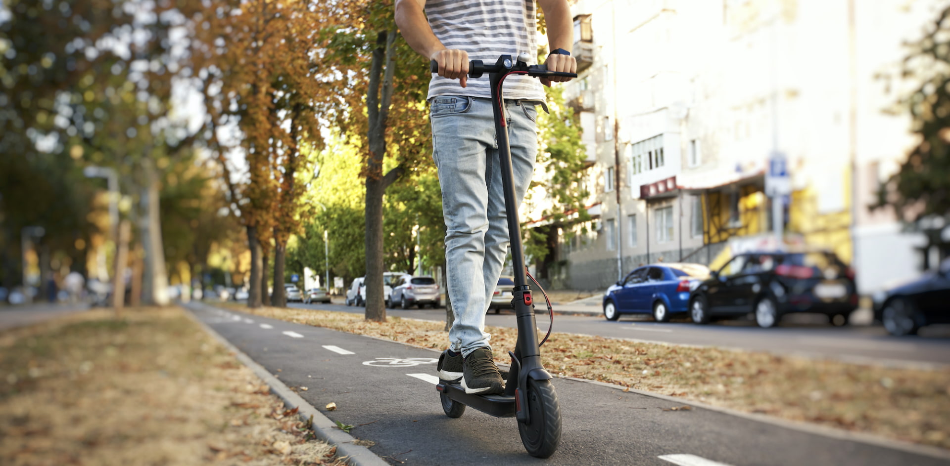 E-scooter user riding on the sidewalk